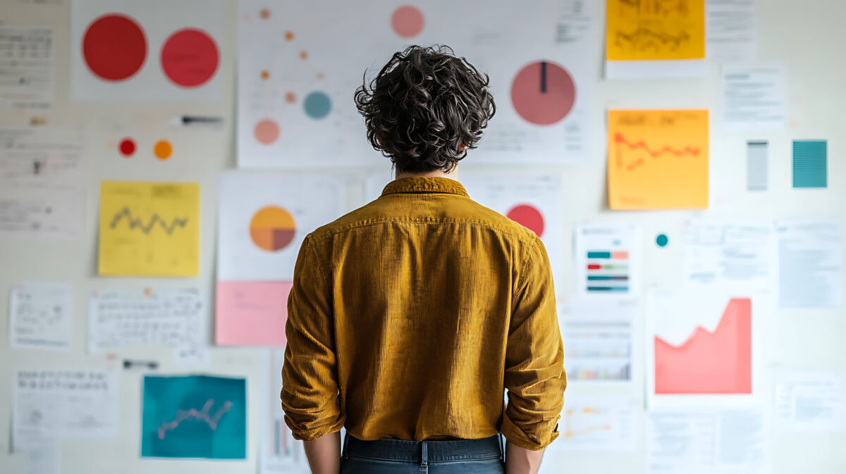 businessman examines various data charts and graphs with strategizing his next move for scene is set in an office innovation strategy planning business marketing financial concept.